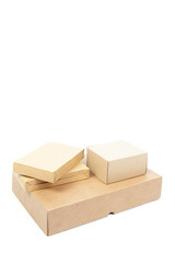 Small brown cardboard boxes stacked on top large box.