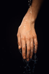 Fototapeta premium From a hand water drips