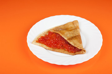 Pancake with red caviar