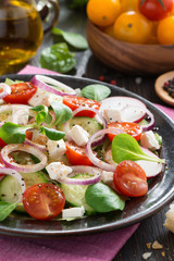 vegetable salad with feta cheese, vertical, close-up