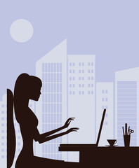 Silhouette of woman with laptop