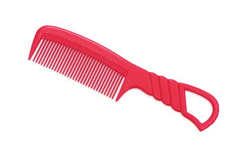 red plastic comb on white background