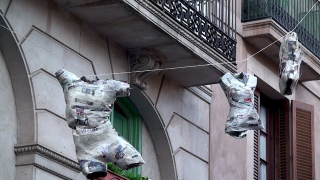 Art-installation in Barcelona. Mannequins with glued newspapers