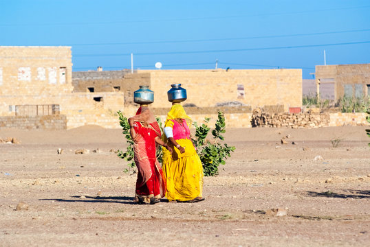 Women carrying water in Rajasthan, India