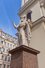 Fototapeta na wymiar St Paul statue of St Peter Lutheran Church (1838) in St Petersbu