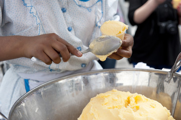 Getting ice cream ready on a sunny day.