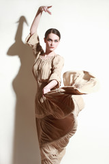 Woman dancing flamenco dancer in long flying dress