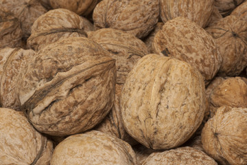 Heap of walnuts on table