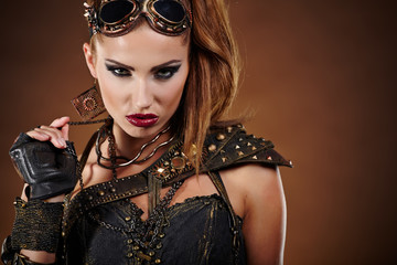 Steampunk woman over gunge background. . Fantasy fashion for cov