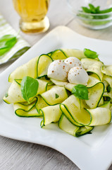 Fresh zucchini salad with basil and mozzarella