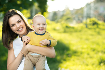 Happy mother holding a young son