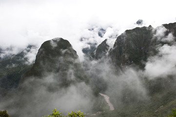 A view from Machu Picchu on a cloudy day.