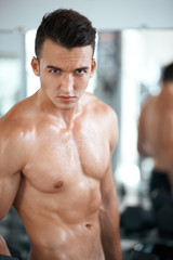 Fototapeta na wymiar strong guy in the gym