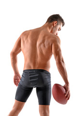 Fototapeta premium Musculoso jugador de rugby sujetando un balon.