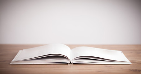 Open book on wooden deck