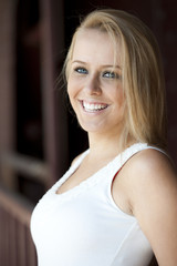 Fototapeta premium A young attractive female blonde model posing outside on a sunny day.