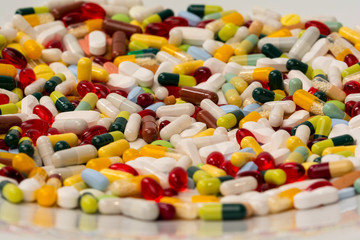 various pills and capsules as background