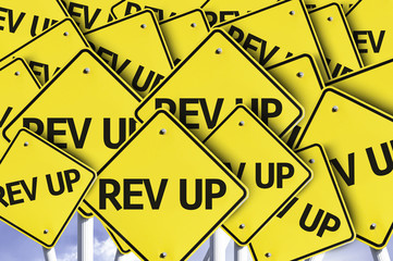 Rev Up written on multiple road sign