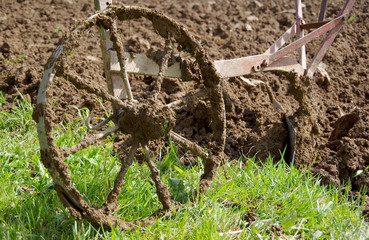 Electric winch and hand plow for plowing