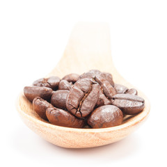 Wooden spoon with coffee beans  isolated on white background.