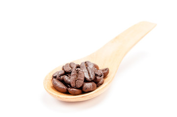 Wooden spoon with coffee beans  isolated on white background.