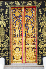 Traditional Thai style carving and painting art at the temple