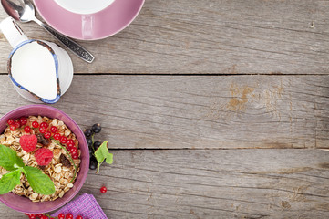 Healty breakfast with muesli, berries and milk