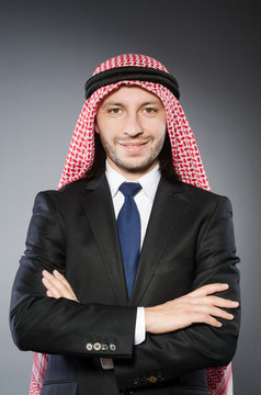 Arab businessman againt grey background