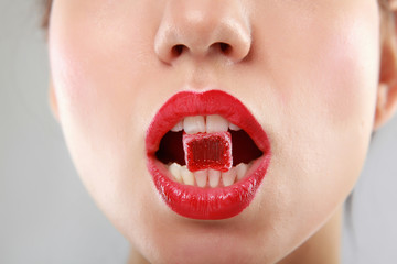 Woman sucking cute sweet candy