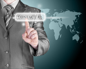 businessman hand pushing contact us button