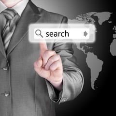 Businessman pushing virtual search bar