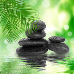 spa Background -  black stones and bamboo on water