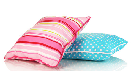 Blue and pink bright pillows isolated on white