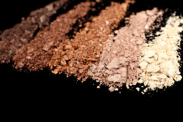 Crushed eyeshadow isolated on black