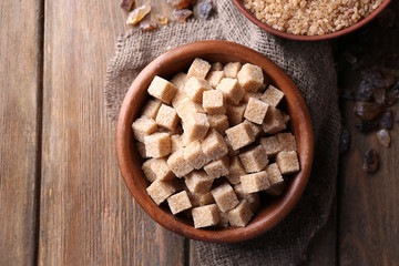 Brown sugar cubes, reed and crystal sugar in bowl