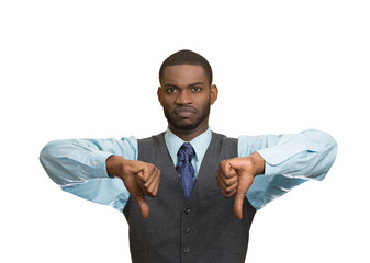 Displeased customer executive man giving thumbs down gesture