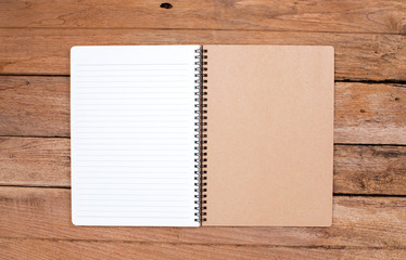 Blank notebook on old wood background