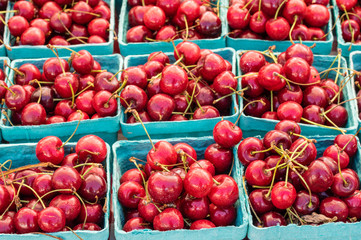 Fresh sweet red cherries in boxes