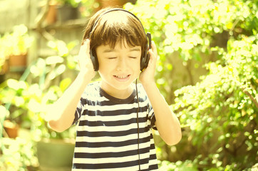 Little boy listening the sound of nature vintage style
