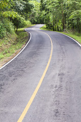 Curve way of asphalt road through the tropical forest in norther
