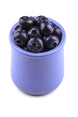 Blueberry in a cup isolated on white