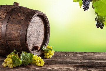 Wine keg on wood with blur green background