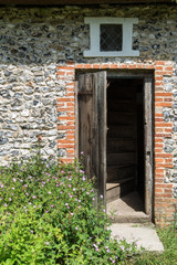 Fototapeta na wymiar Entrance door to Medieval 18th century cottage