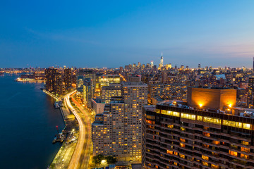 Fototapeta na wymiar New York City skyline with urban skyscrapers at sunset.