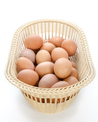 Eggs in basket isolated