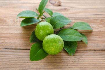 Green lemon in wooden floor