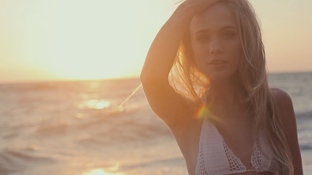 Gorgeous young girl with a beautiful figure in  swimsuit near
