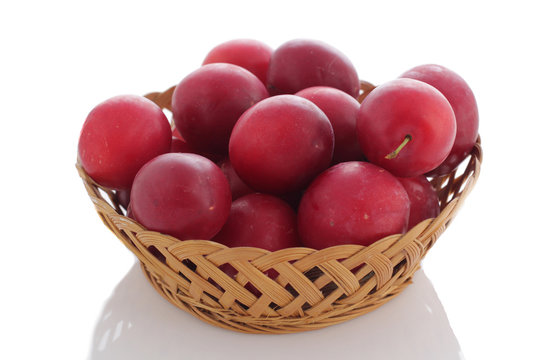 Plums in wooden  basket