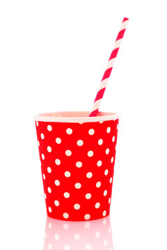 Red plastic glass on a white background