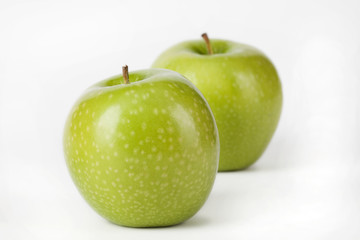 Green apple fruits on white background